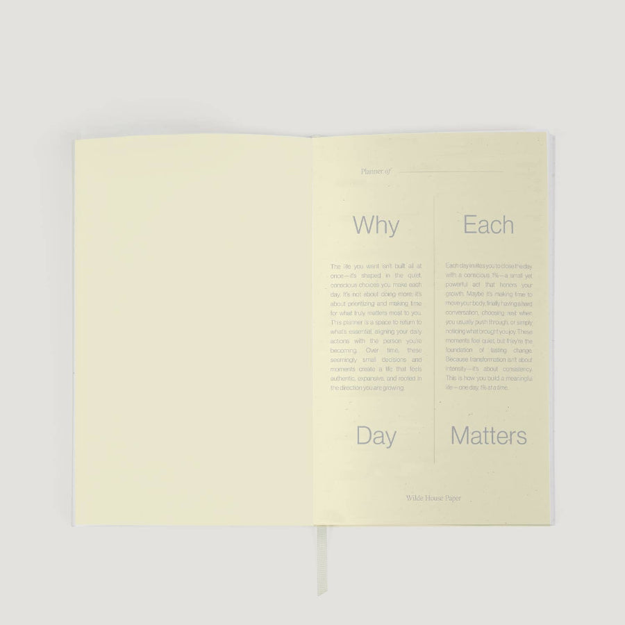 Open book with text on a light gray background