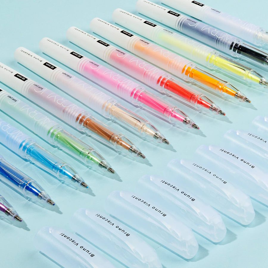 Set of colorful pens on a light blue background