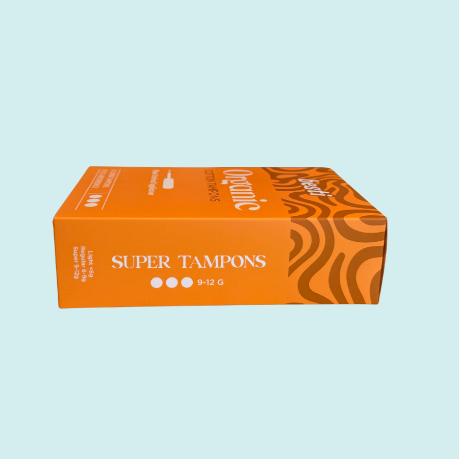 Orange box of super tampons on a light blue background