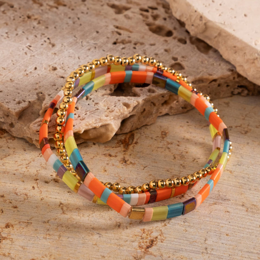 Colorful beaded bracelet on a stone surface
