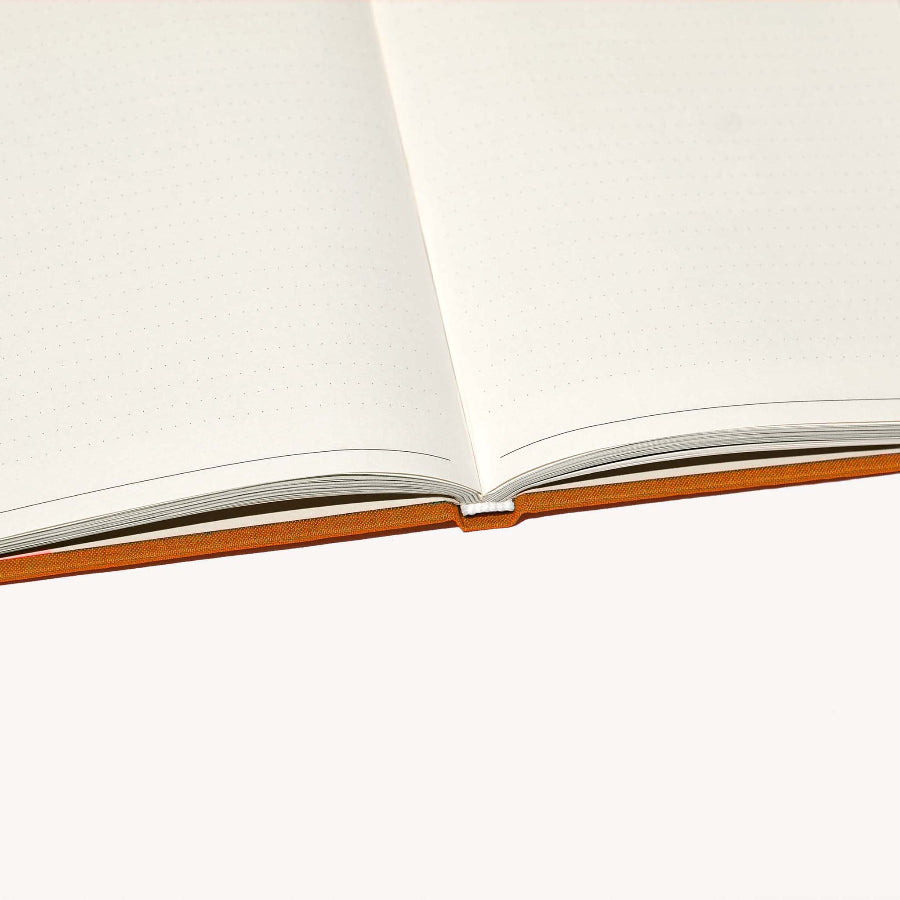 Open notebook with white pages on a white background
