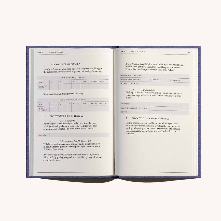 Open book with text and tables on a white background