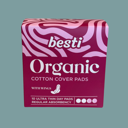 Box of besti Organic Cotton Cover Pads on a solid background