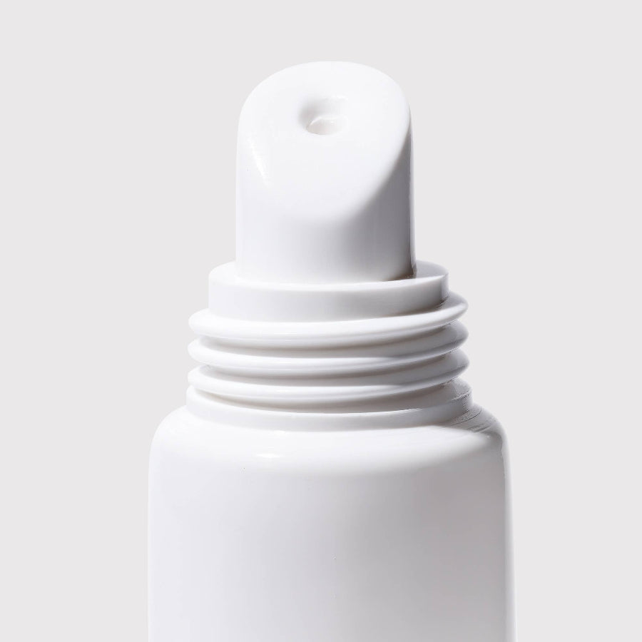 White dropper bottle on a light gray background