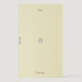 Beige planner with 'Day' and 'Planner' text on a white background
