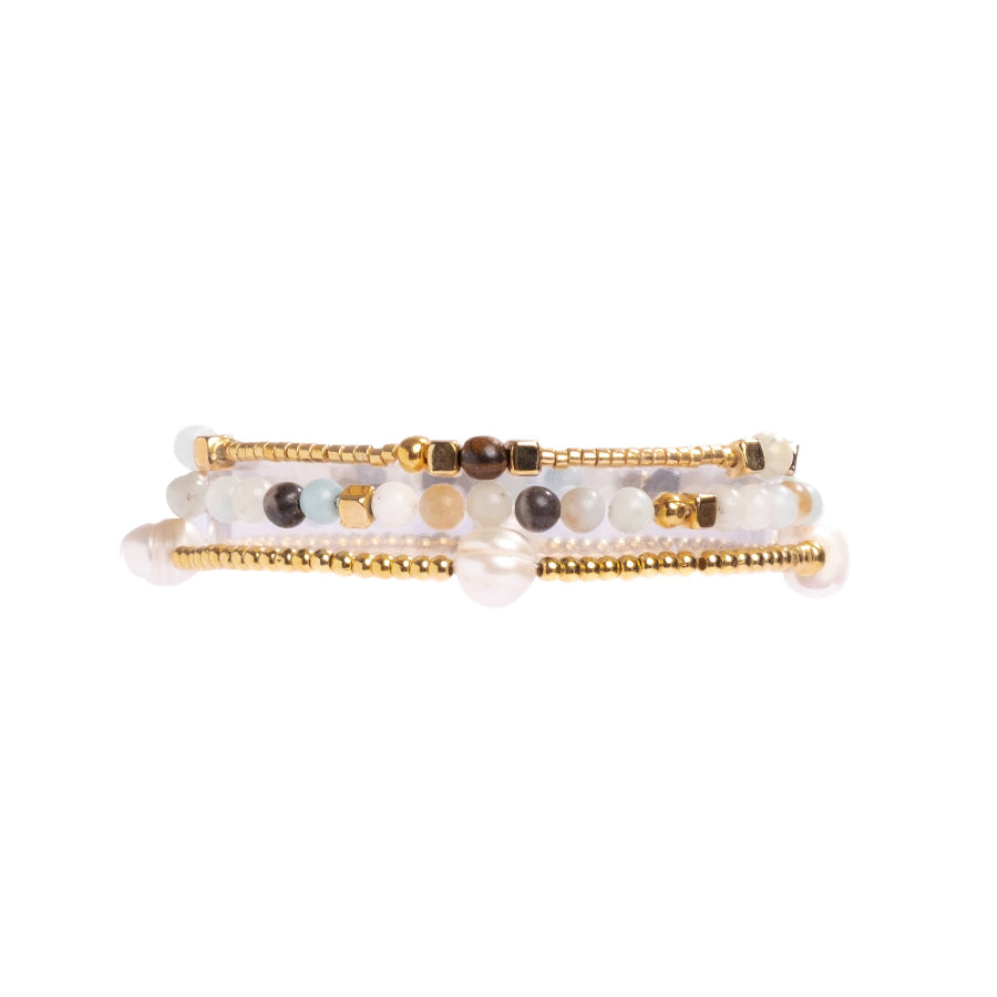 Two beaded bracelets on a white background