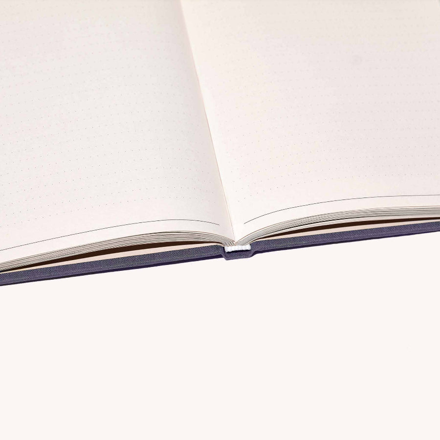 Open notebook with white pages on a light gray background