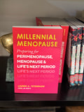 Book titled 'Millennial Menopause' on a shelf with other books.