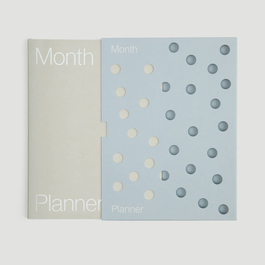 Two planners with different cover designs on a white background