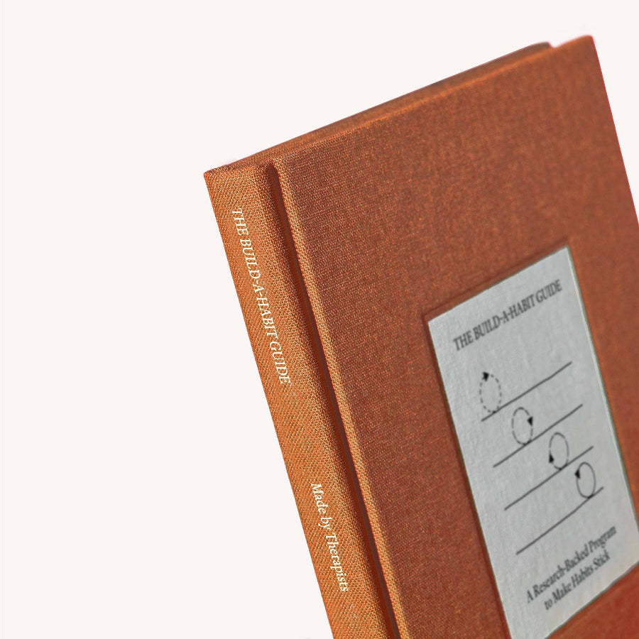 Brown book with a label on a white background