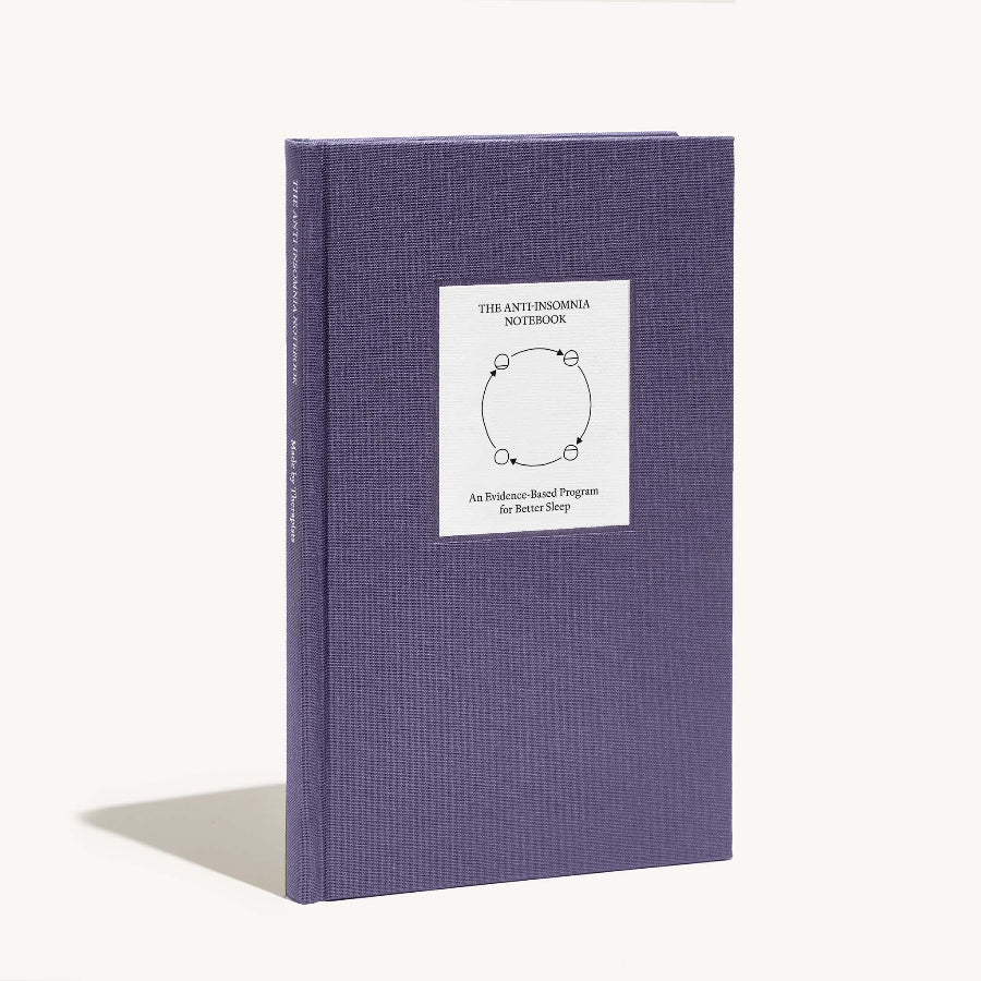 Purple book with a white label on a white background