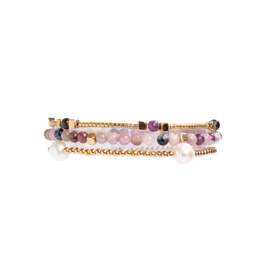 Set of three beaded bracelets on a white background