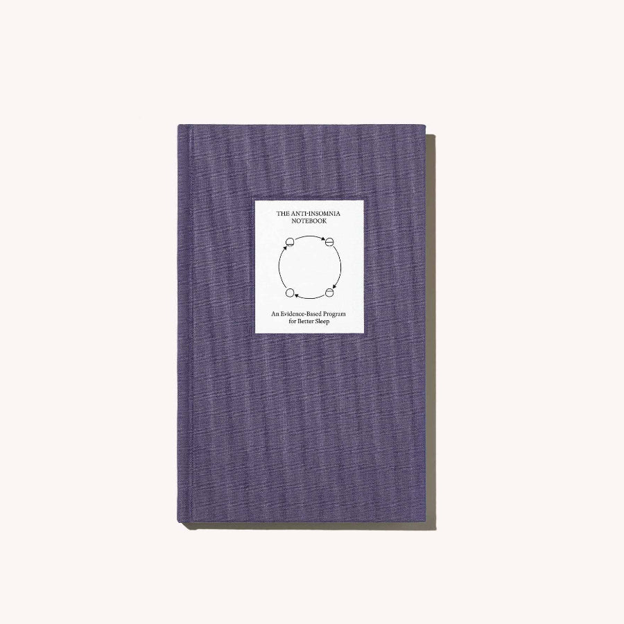 Purple notebook with a white label on a white background
